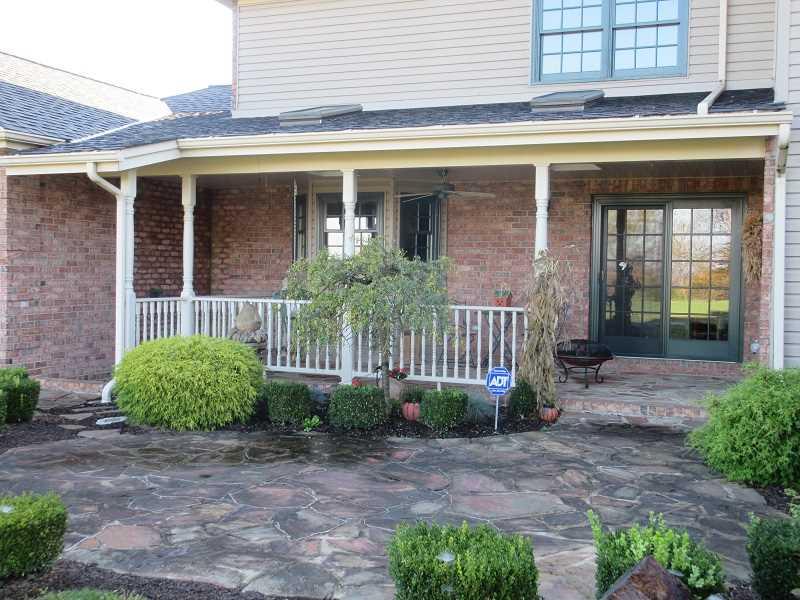 675 Freeport Road Freeport, PA 16229 - Photo 22 of 25 Patio/Deck. Covered back porch and flagstone patio.