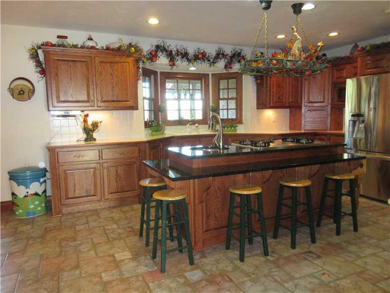 675 Freeport Road Freeport, PA 16229 - Photo 4 of 25 Kitchen. Ceramic tile floor, recessed lighting, island with cooktop and sink
