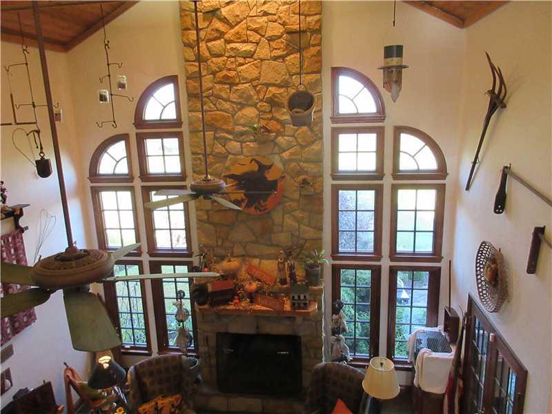 675 Freeport Road Freeport, PA 16229 - Photo 10 of 25 Family Room. 2 story stone fireplace with a stone mantle and a wood mantle.