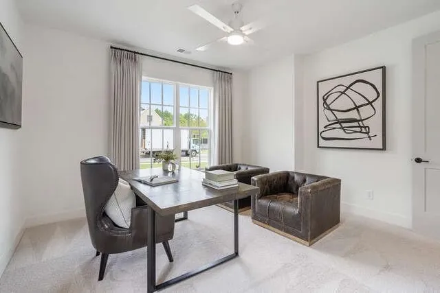 a bedroom with a bed a chandelier and couch