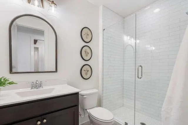 a bedroom with bed and a dresser