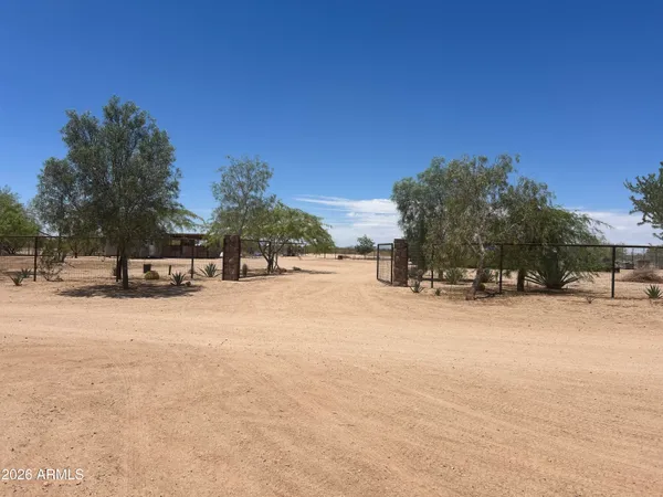 a view of a road with a building in the background