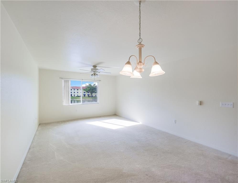 8224 Key Royal Circle, Unit 223 Naples, FL 34119 - Photo 2 of 14 a view of a room with a window and a fan