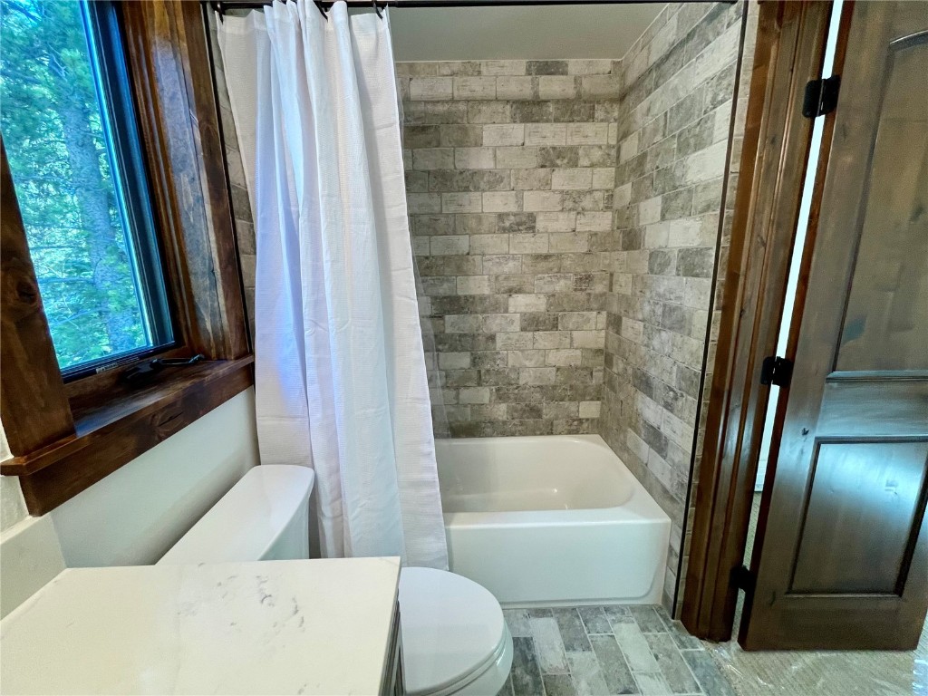 204 Blue Ridge Road Breckenridge, CO 80424 - Photo 15 of 40 Full bathroom featuring shower / bath combination with curtain, toilet, and vanity