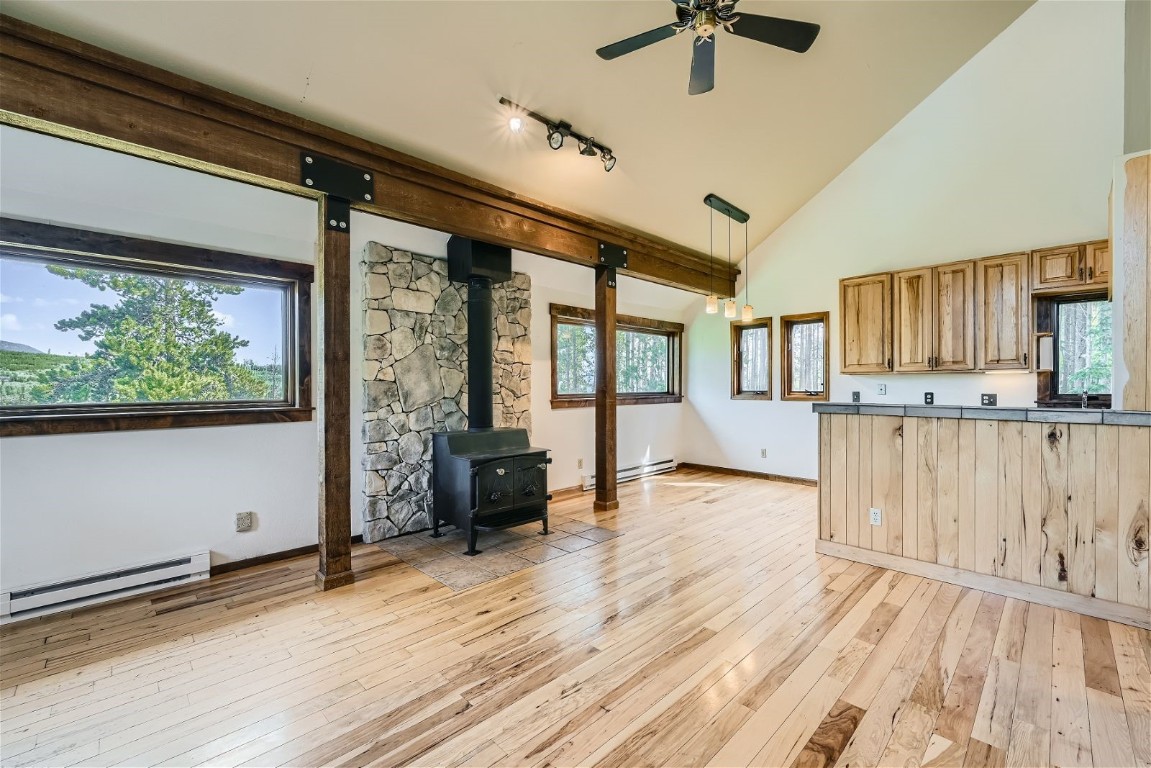 204 Blue Ridge Road Breckenridge, CO 80424 - Photo 23 of 40 living and dining area, kitchen and wood stove