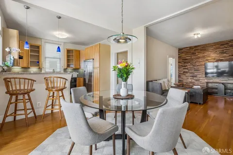 a bathroom with a granite countertop bathtub shower sink and mirror