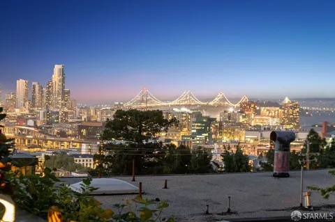 a view of a dining room with furniture wooden floor and chandelier