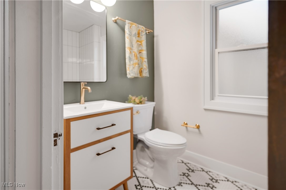 2016 Rossmoor Road Cleveland Heights, OH 44118 - Photo 27 of 46 Half bathroom with vanity and toilet