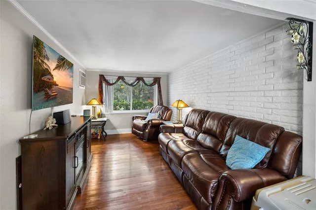 a front view of a house with a fountain and a porch