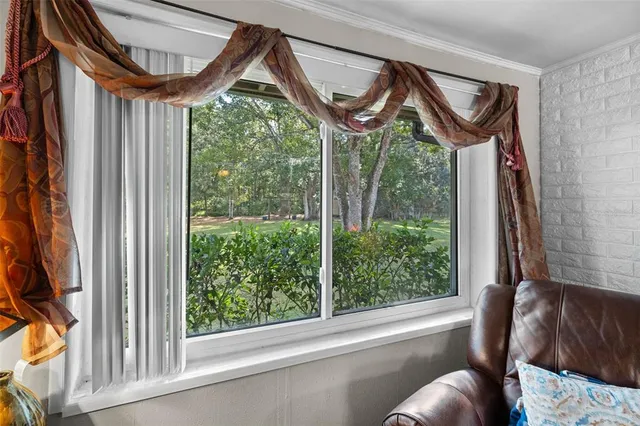 a kitchen with granite countertop stainless steel appliances a stove sink and cabinets
