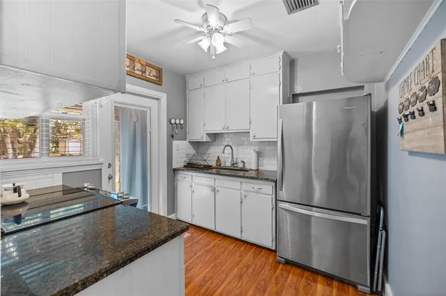 a view of a dining room with furniture and a window