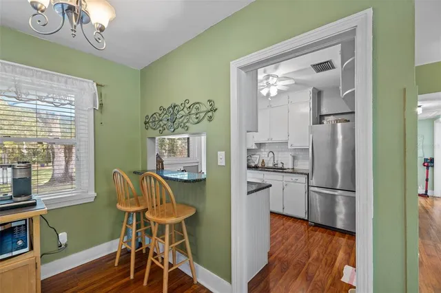a view of a dining room with furniture