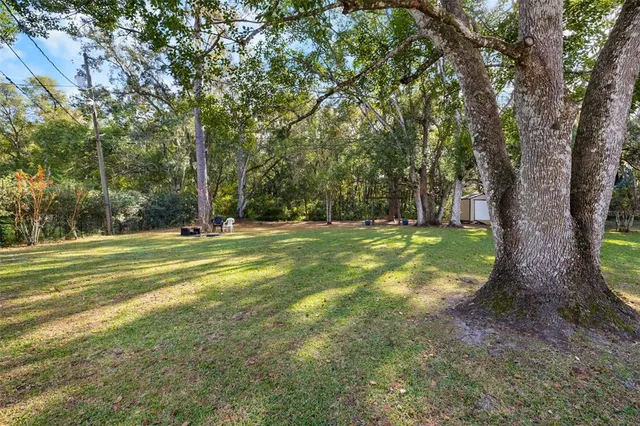 a view of a house with a big yard