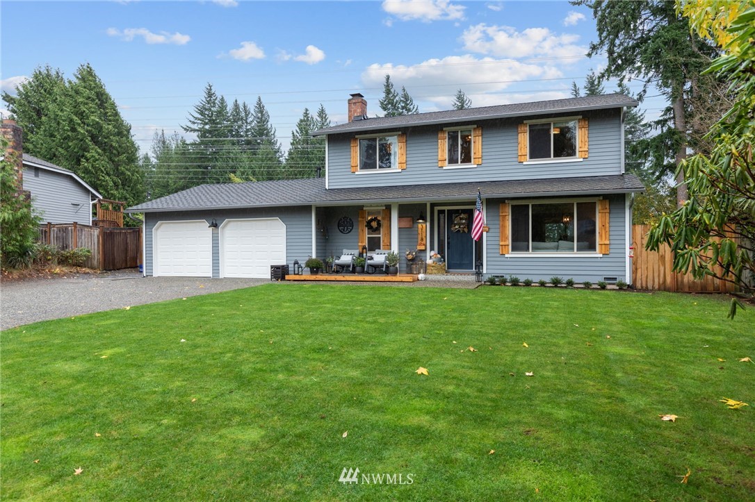 3118 167th Street Southeast Bothell, WA 98012 - Photo 1 of 38 a front view of a house with garden