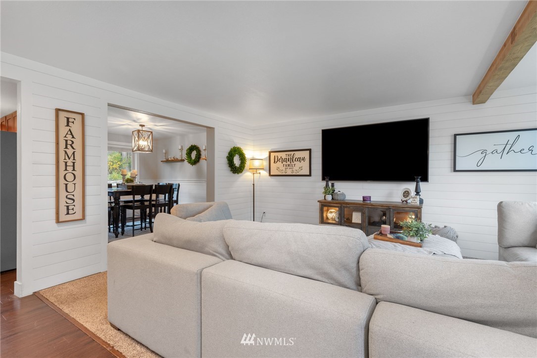 3118 167th Street Southeast Bothell, WA 98012 - Photo 2 of 38 a living room with furniture and a flat screen tv