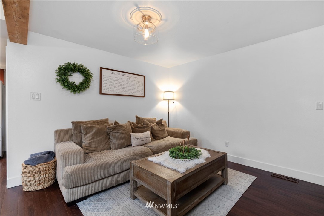 3118 167th Street Southeast Bothell, WA 98012 - Photo 16 of 38 a living room with furniture and a wooden floor