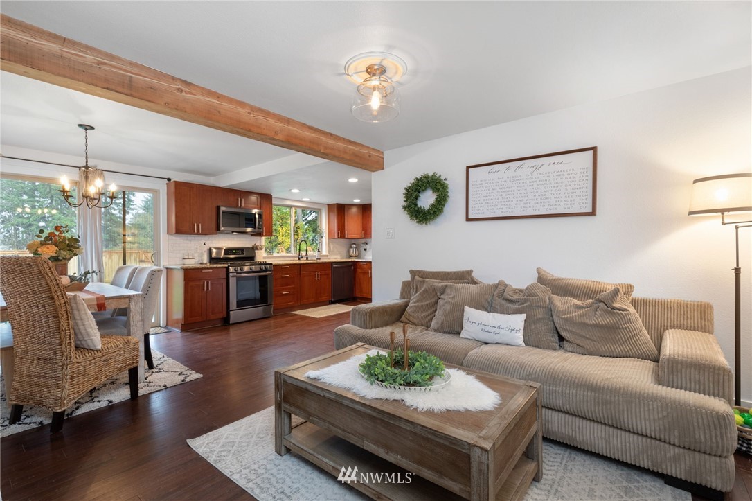 3118 167th Street Southeast Bothell, WA 98012 - Photo 17 of 38 a living room with furniture and kitchen view