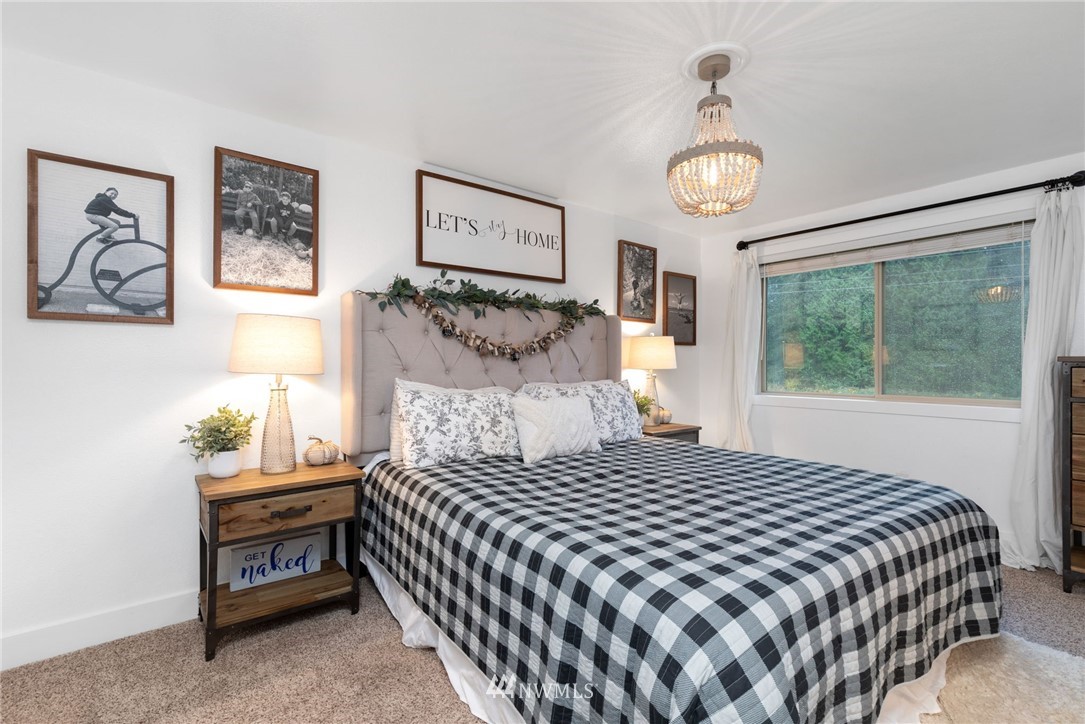 3118 167th Street Southeast Bothell, WA 98012 - Photo 21 of 38 a bedroom with a bed and a window