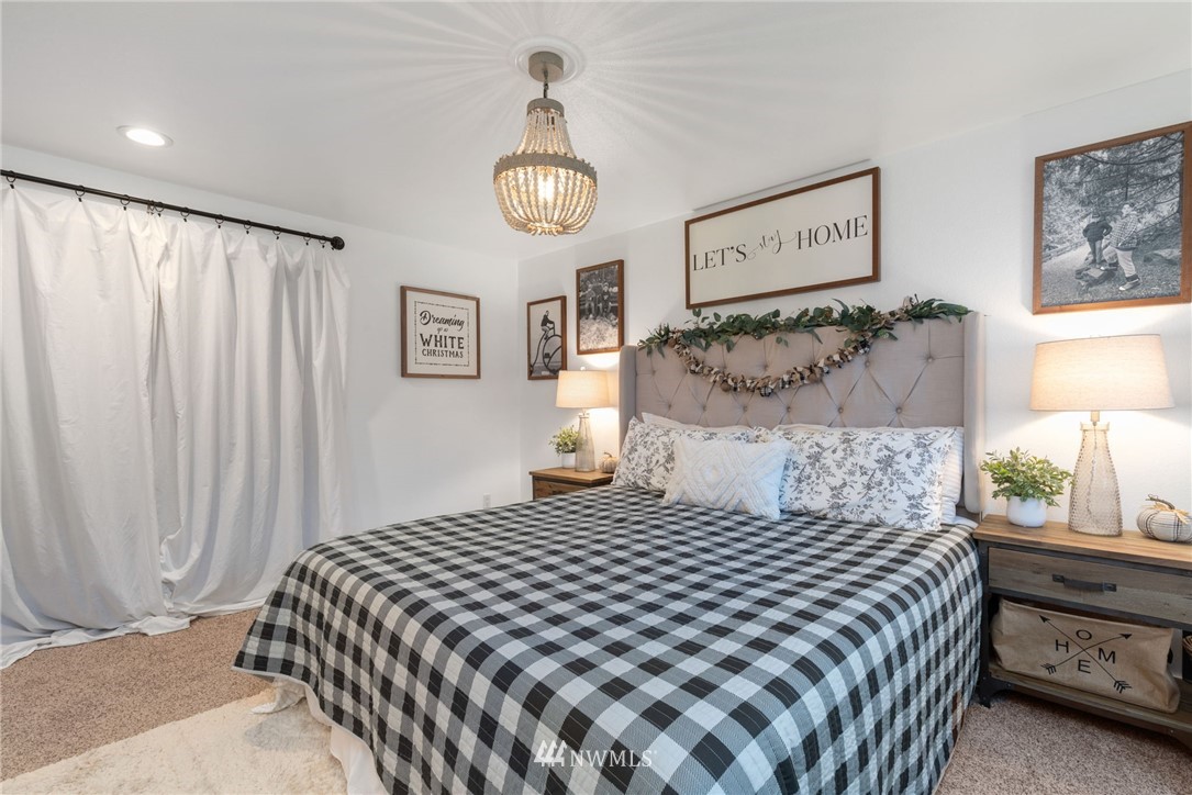 3118 167th Street Southeast Bothell, WA 98012 - Photo 24 of 38 a bedroom with a large bed and a window