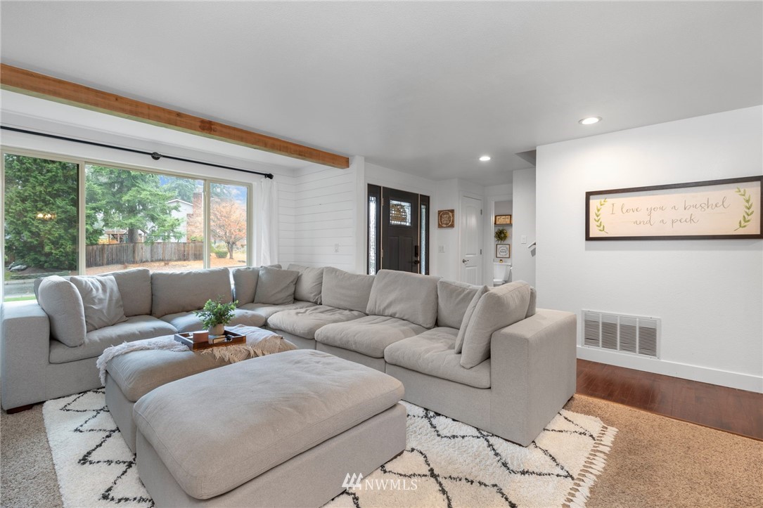 3118 167th Street Southeast Bothell, WA 98012 - Photo 4 of 38 a living room with furniture and a large window