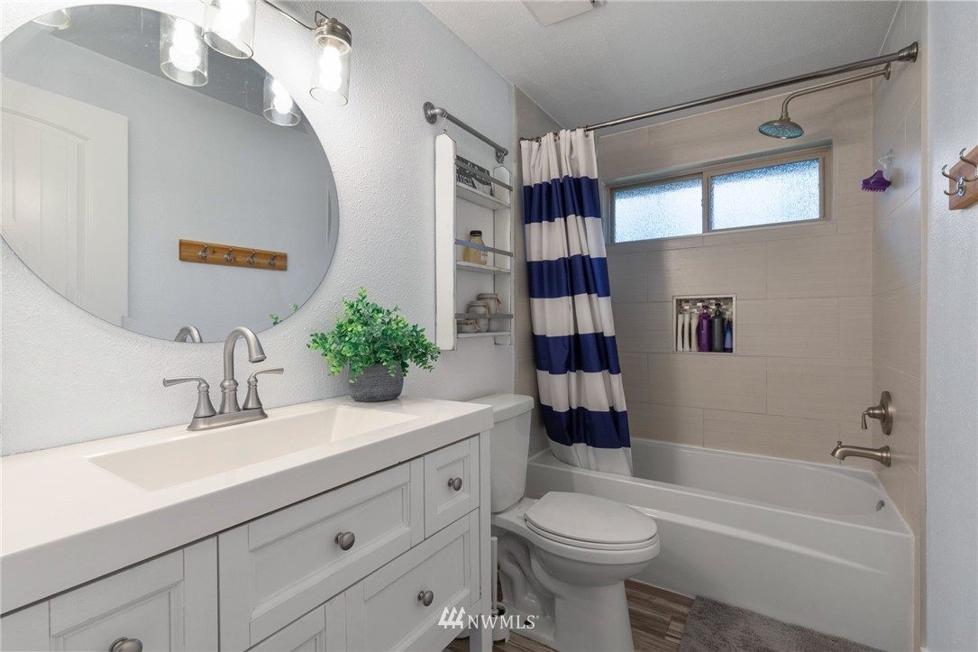 3118 167th Street Southeast Bothell, WA 98012 - Photo 33 of 38 a bathroom with a sink a toilet and shower