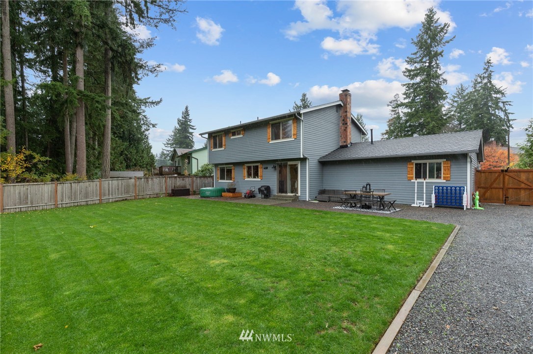 3118 167th Street Southeast Bothell, WA 98012 - Photo 36 of 38 a view of a house with a yard porch and sitting area