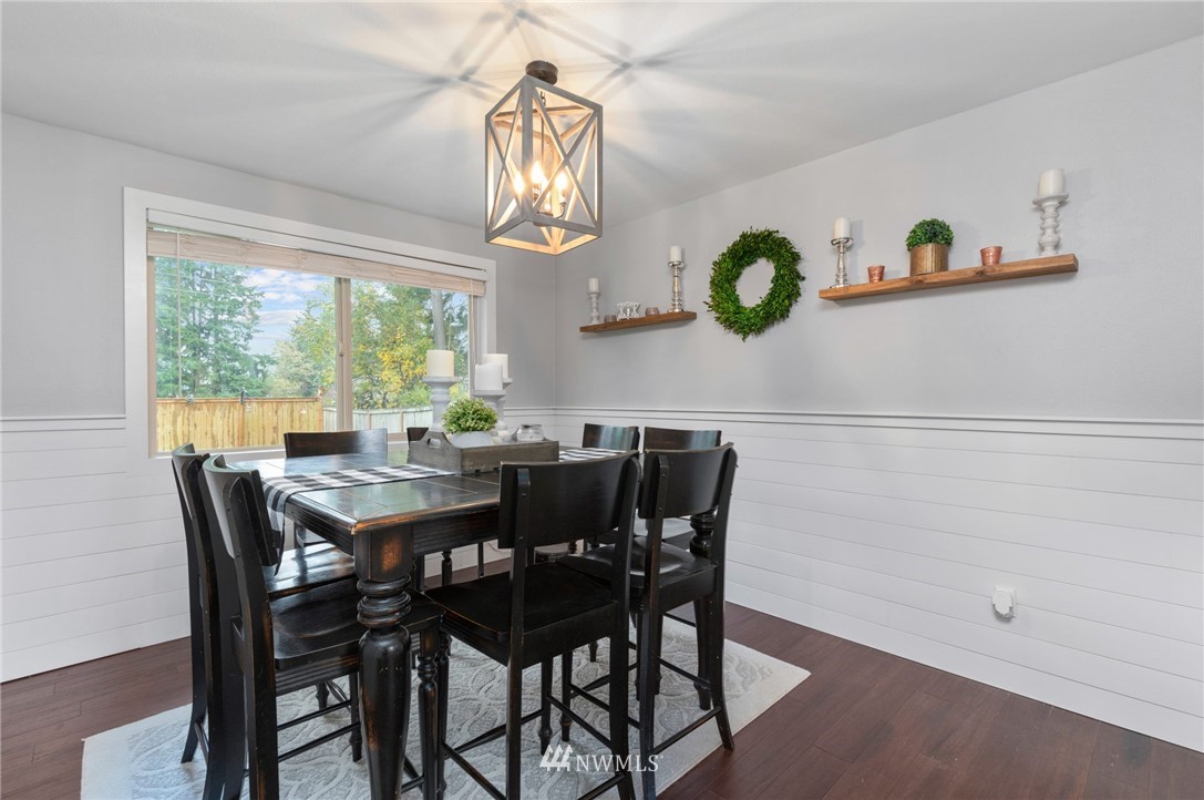 3118 167th Street Southeast Bothell, WA 98012 - Photo 6 of 38 a view of a dining room with furniture and chandelier