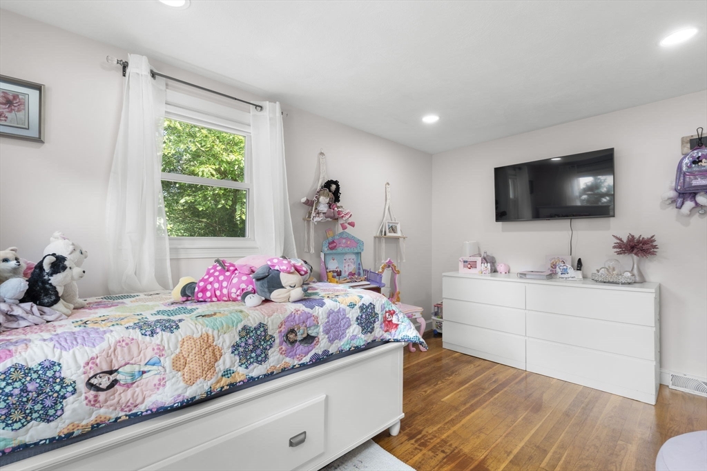 8 Governor Fuller Road Billerica, MA 01821 - Photo 21 of 33 a bedroom with a bed and a flat screen tv
