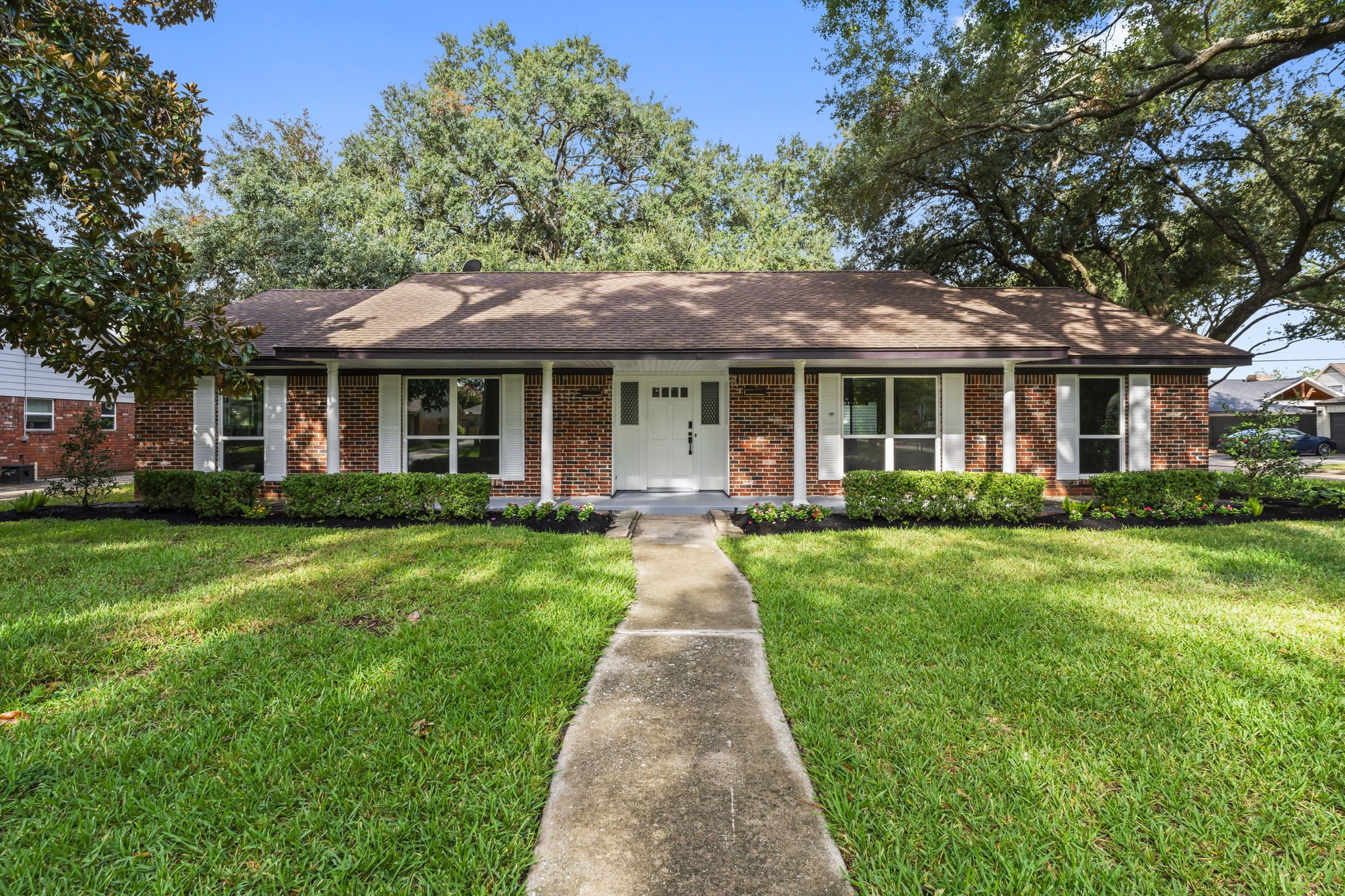 a front view of a house with yard