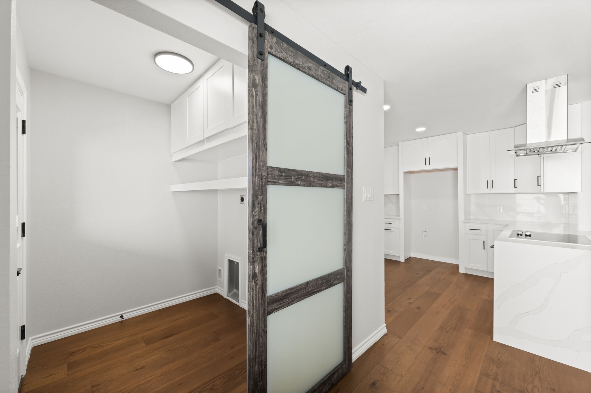 2535 Southwick Street Houston, TX 77080 - Photo 11 of 26 an empty room with wooden floor and white walls