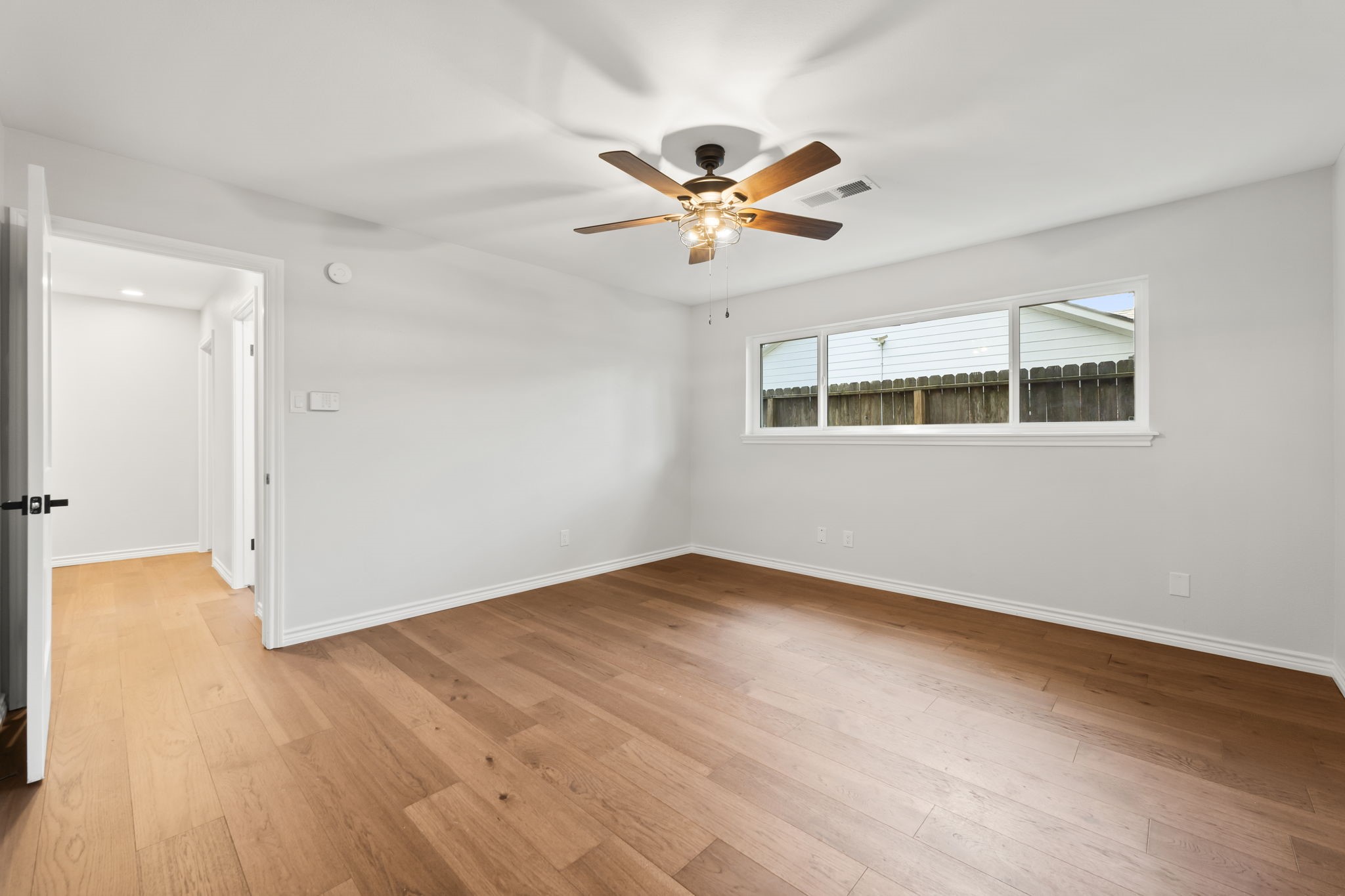 2535 Southwick Street Houston, TX 77080 - Photo 14 of 26 a view of empty room with wooden floor