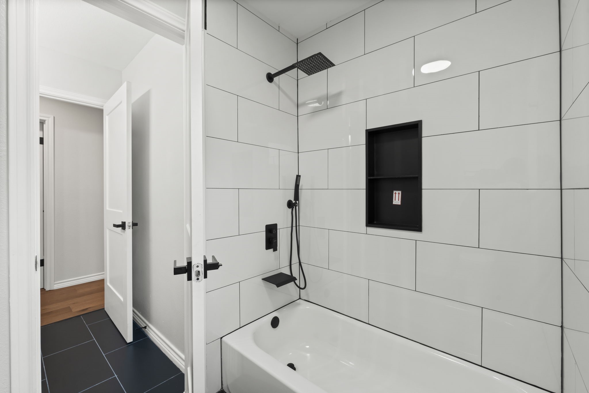 2535 Southwick Street Houston, TX 77080 - Photo 22 of 26 a bathroom with a bathtub and a shower