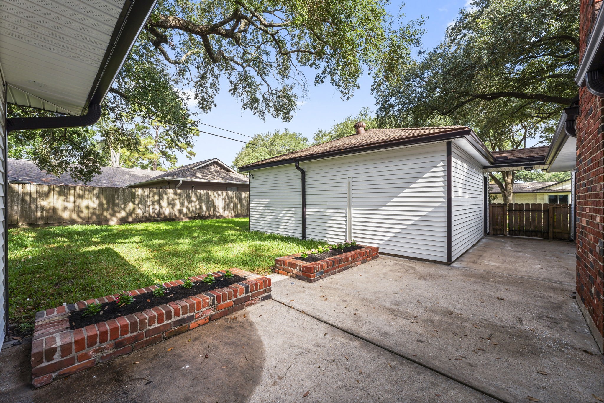 2535 Southwick Street Houston, TX 77080 - Photo 24 of 26 a view of a house with a yard and garage