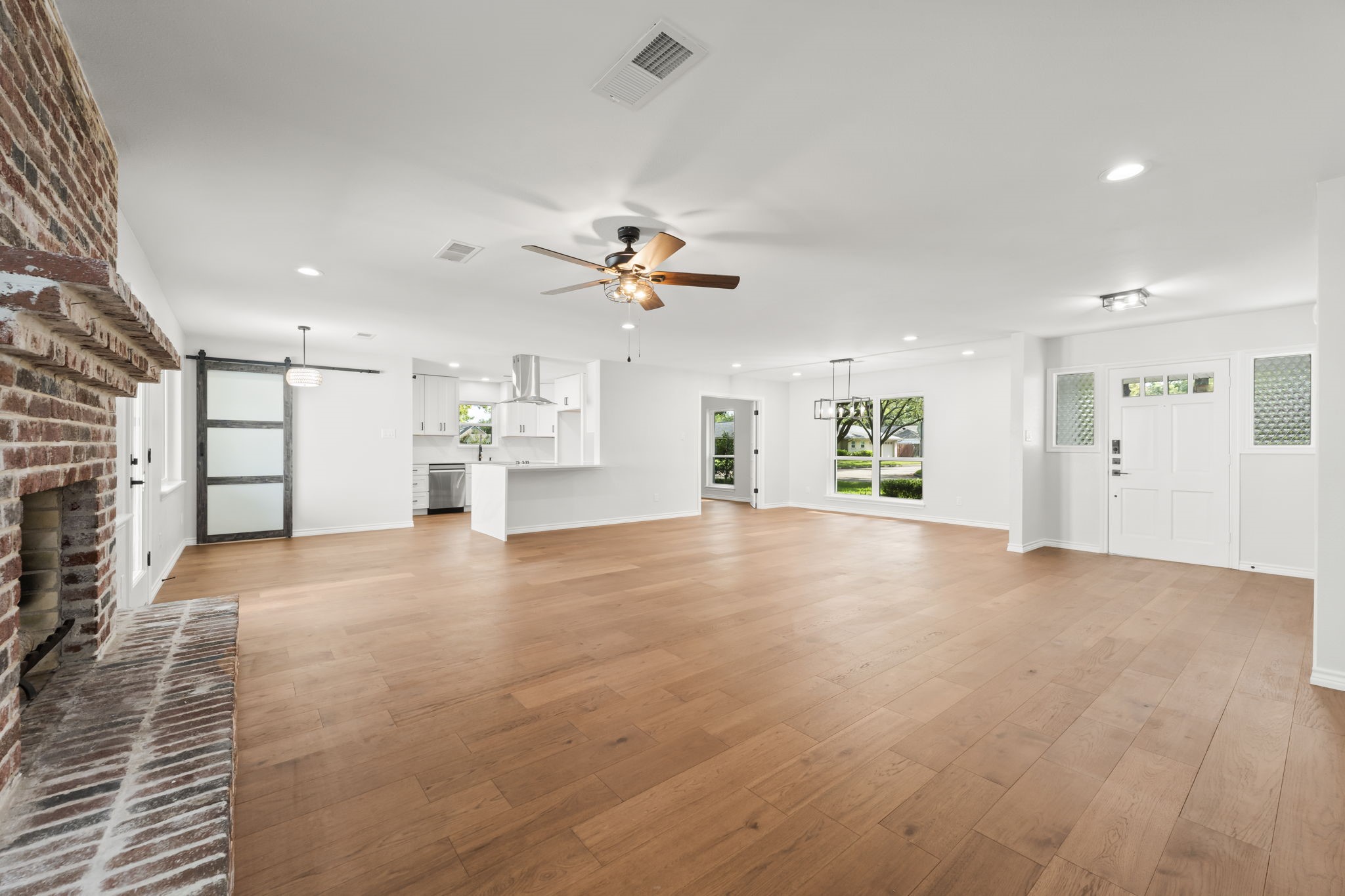 2535 Southwick Street Houston, TX 77080 - Photo 8 of 26 a view of an empty room with a kitchen