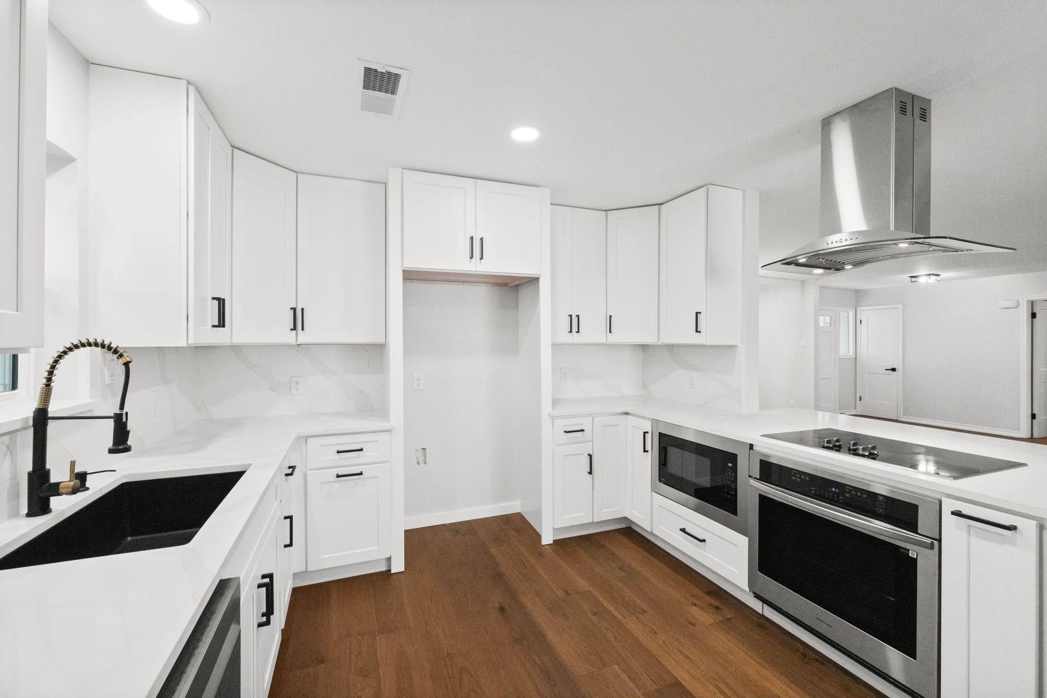 2535 Southwick Street Houston, TX 77080 - Photo 9 of 26 a kitchen with granite countertop a stove and a sink