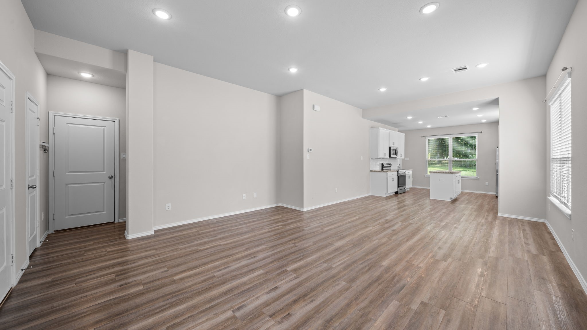 18140 Mail Rte Road Montgomery, TX 77316 - Photo 5 of 26 The spacious open-concept layout offers seamless flow between the living, dining, and kitchen areas.