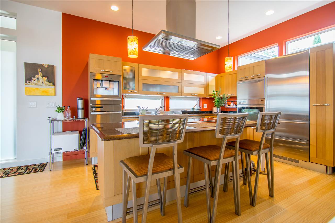 120-122 Ainakula Road Kula, HI 96790 - Photo 11 of 28 a dining room with stainless steel appliances a dining table chairs and a chandelier