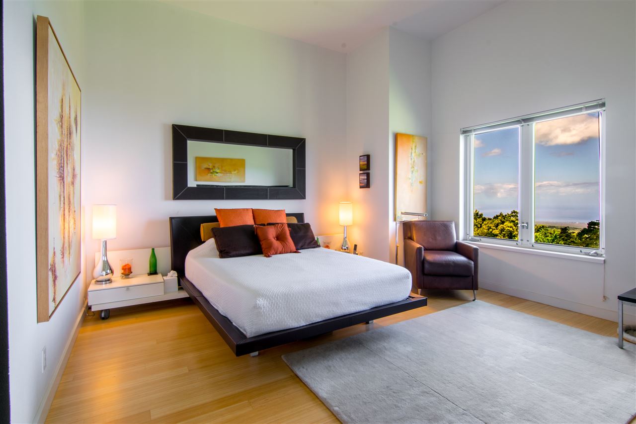 120-122 Ainakula Road Kula, HI 96790 - Photo 12 of 28 a bedroom with a bed and a couch