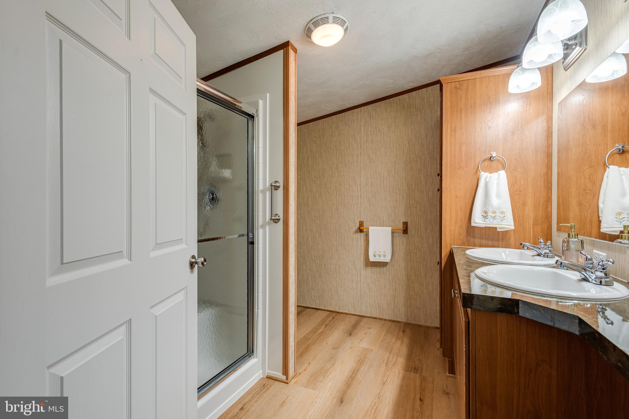 47 Janis Road Gordonville, PA 17529 - Photo 15 of 26 a bathroom with a double vanity sink and mirror with shower