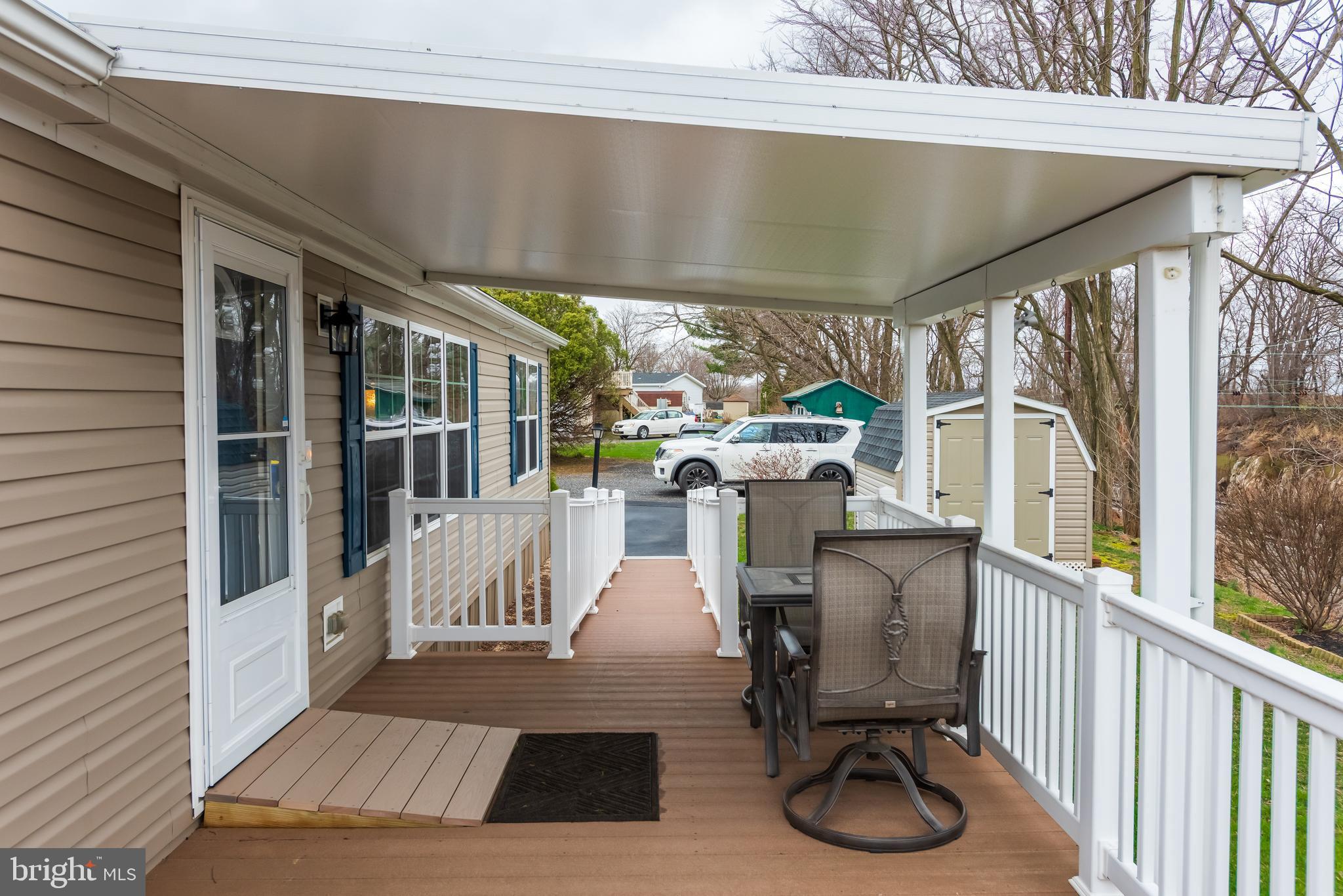 47 Janis Road Gordonville, PA 17529 - Photo 22 of 26 a view of a patio with a table and chairs