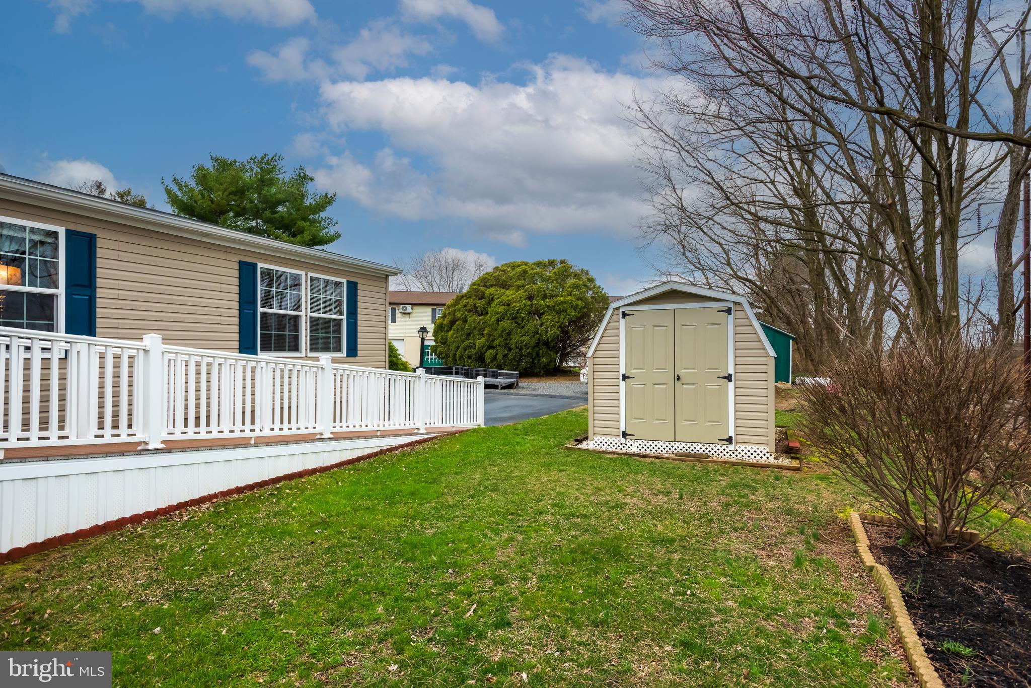 47 Janis Road Gordonville, PA 17529 - Photo 26 of 26 a front view of a house with yard and green space