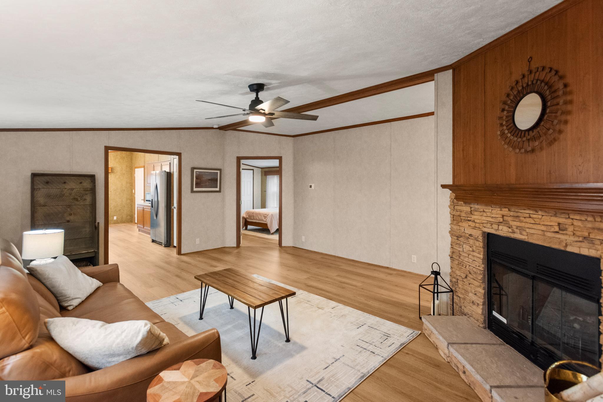 47 Janis Road Gordonville, PA 17529 - Photo 5 of 26 a living room with furniture a fireplace and a flat screen tv