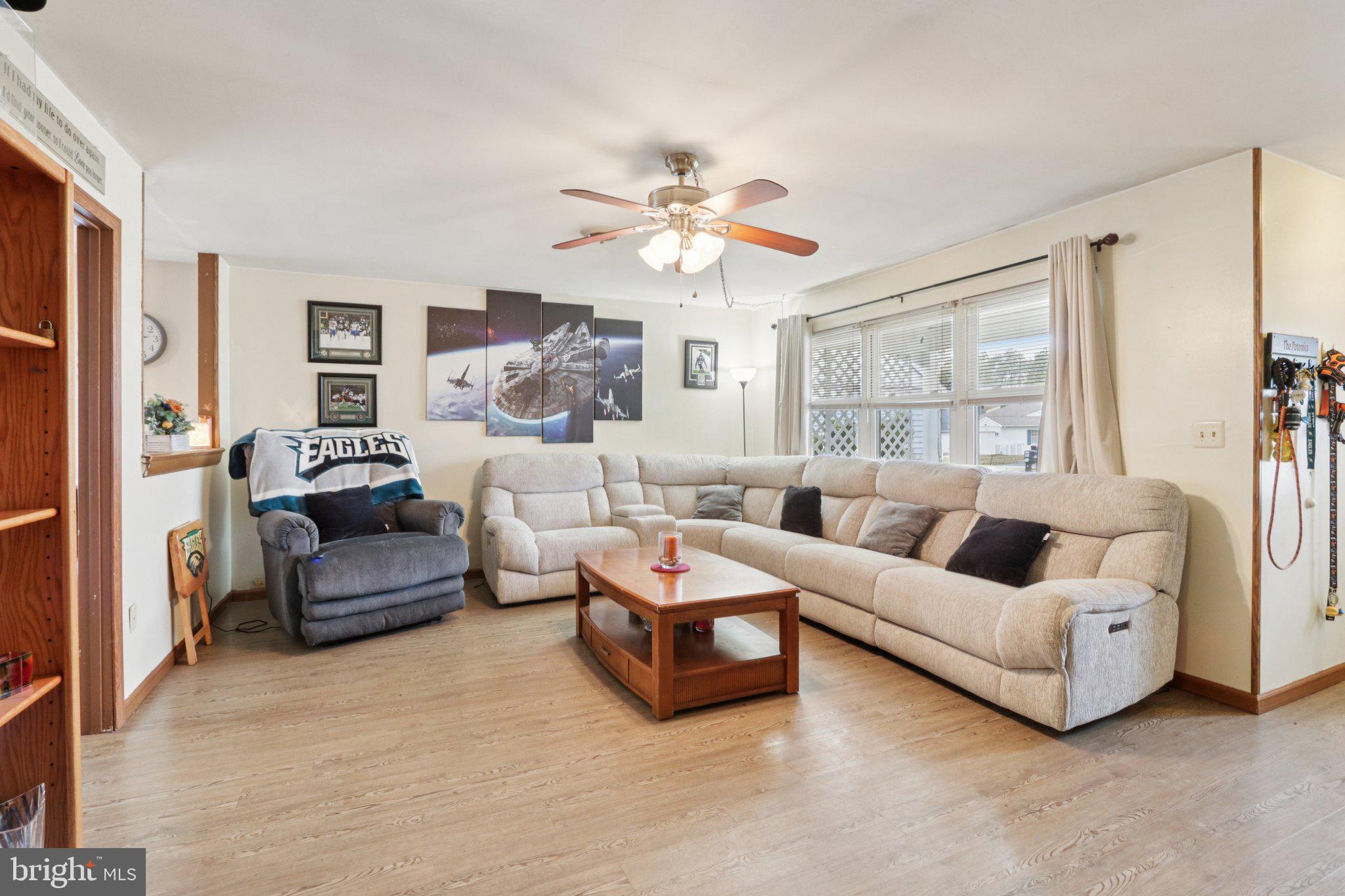 46 Gramercy Place Southampton, NJ 08088 - Photo 11 of 37 a living room with furniture and a large window