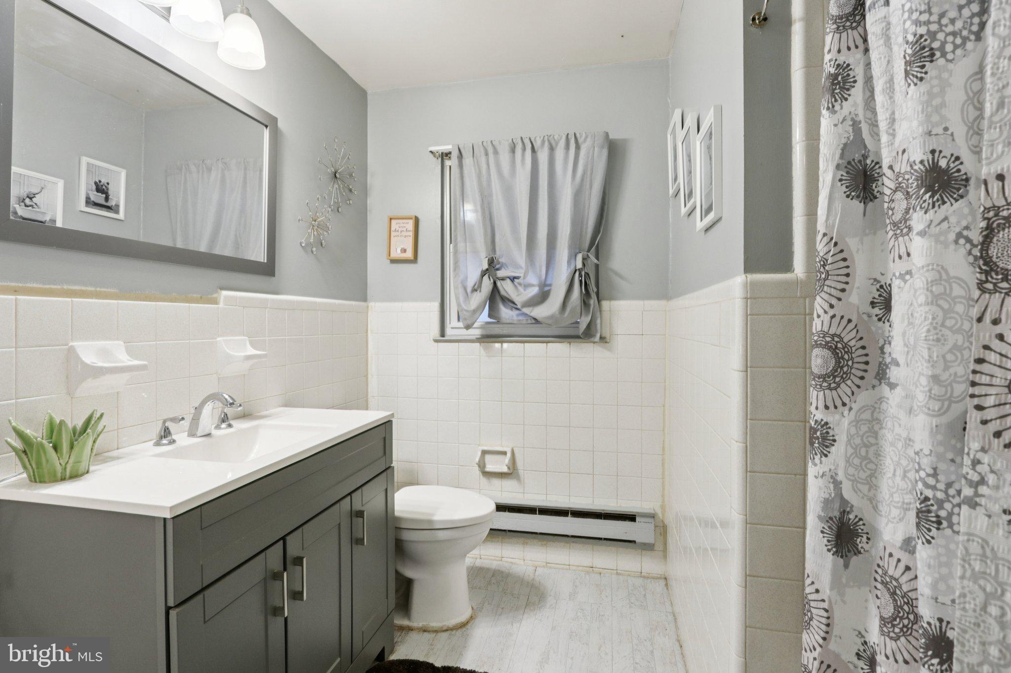 46 Gramercy Place Southampton, NJ 08088 - Photo 18 of 37 a bathroom with a sink mirror and toilet
