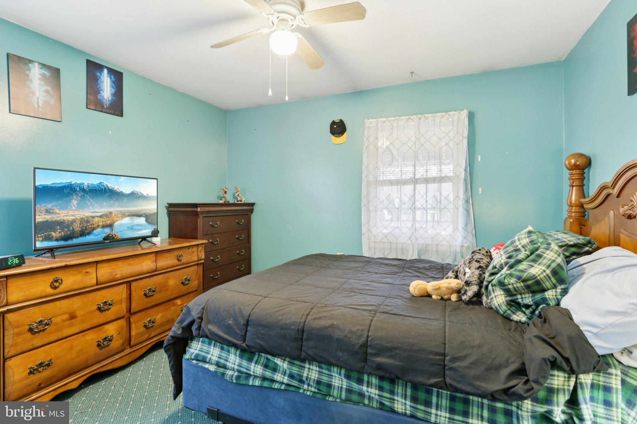 46 Gramercy Place Southampton, NJ 08088 - Photo 19 of 37 a bedroom with a bed and a dresser