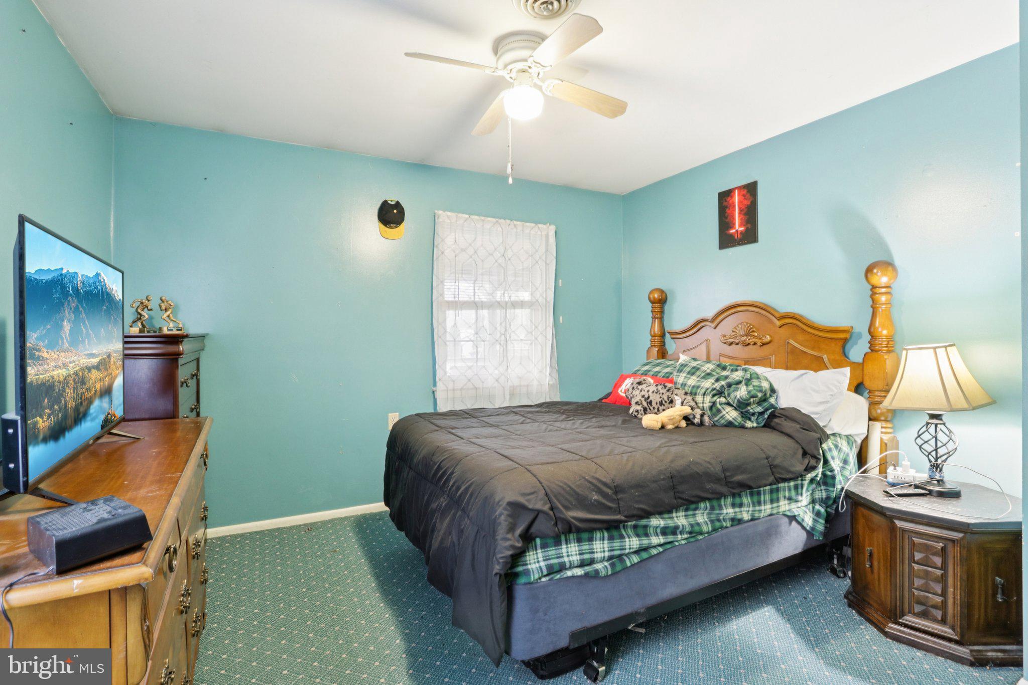46 Gramercy Place Southampton, NJ 08088 - Photo 20 of 37 a bedroom with a bed and a chandelier
