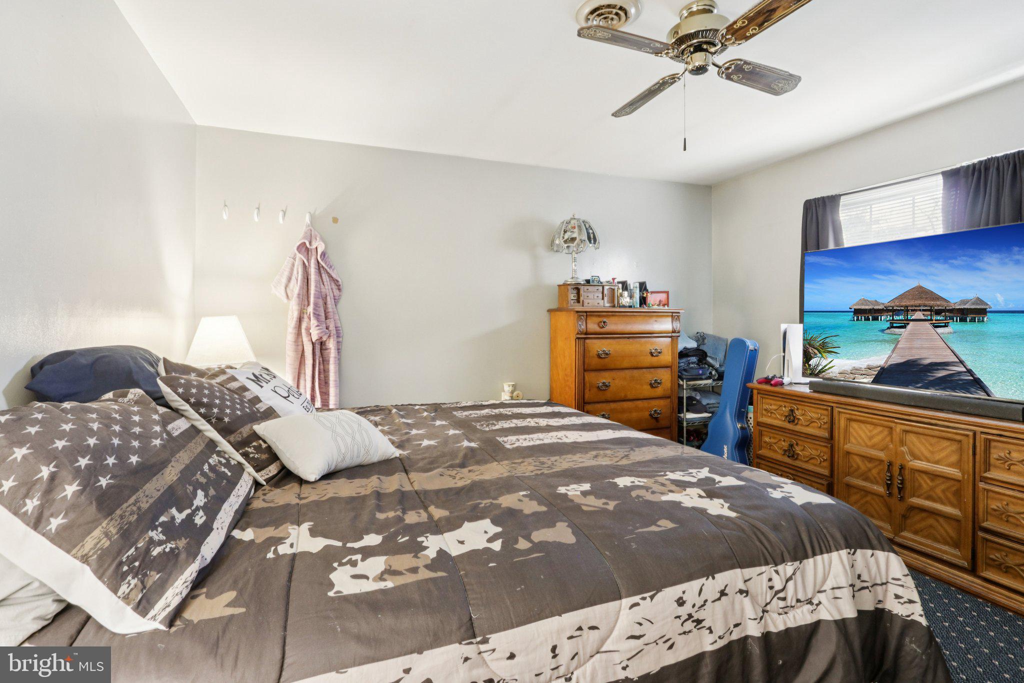 46 Gramercy Place Southampton, NJ 08088 - Photo 23 of 37 a bedroom with a bed and a dresser in it