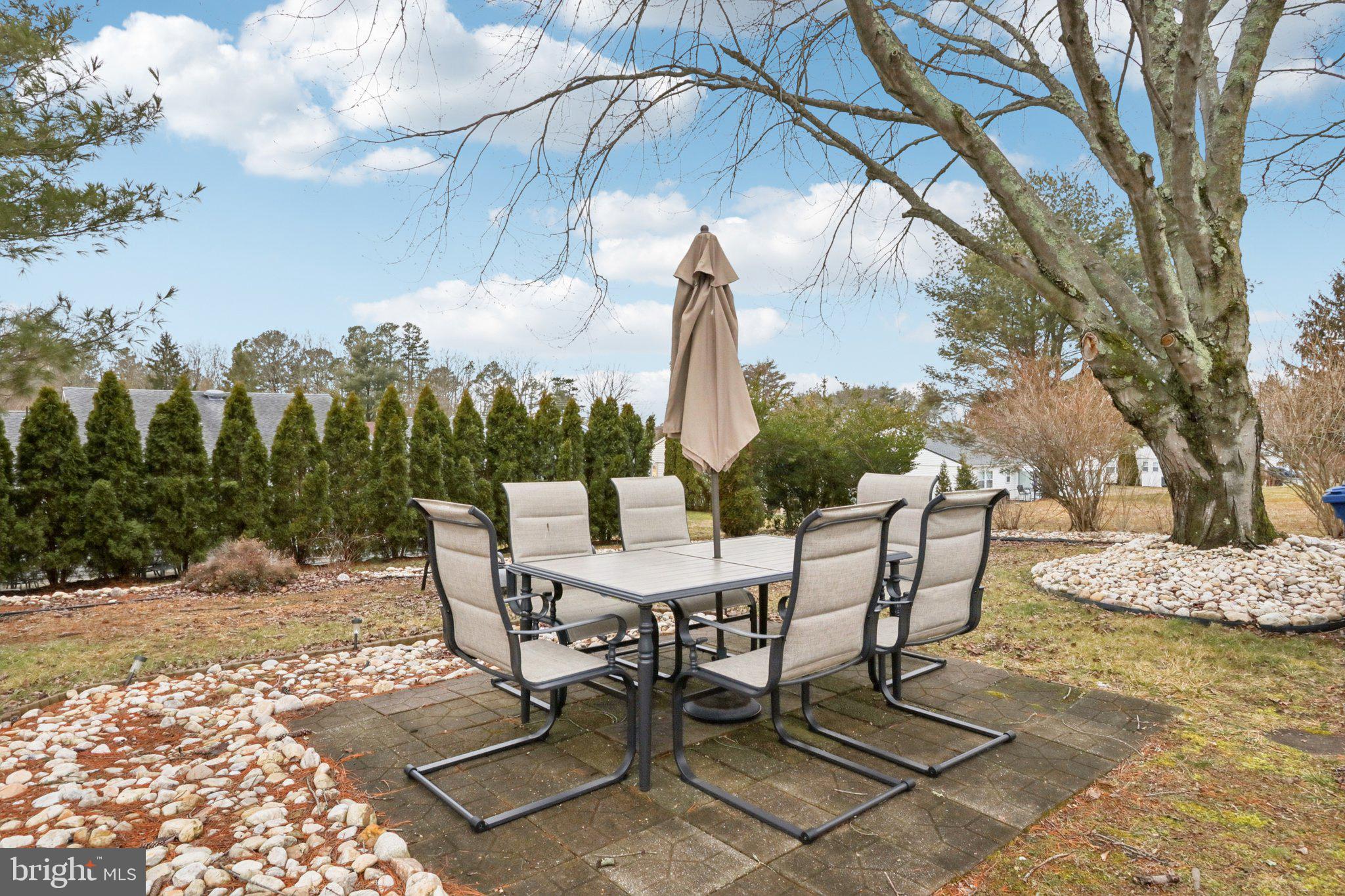 46 Gramercy Place Southampton, NJ 08088 - Photo 31 of 37 a view of a backyard with sitting area