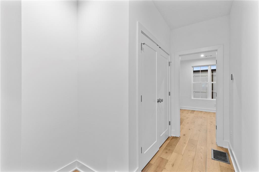 201 New Street, Unit 1204 Decatur, GA 30030 - Photo 13 of 28 a view of a hallway with wooden floor