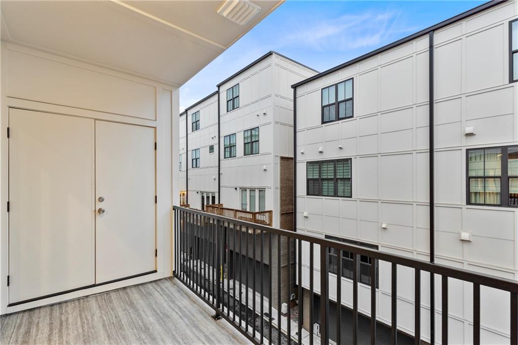 201 New Street, Unit 1204 Decatur, GA 30030 - Photo 24 of 28 a view of a house with a balcony